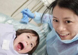 Dr. Zhao giving her youngest his yearly check-up